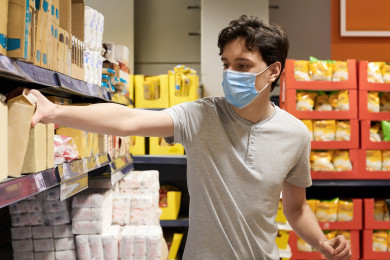 2 Frimufilms via Freepik young-man-with-face-mask-supermarket.jpg