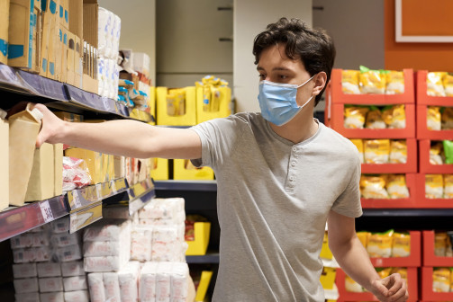 2 Frimufilms via Freepik young-man-with-face-mask-supermarket.jpg